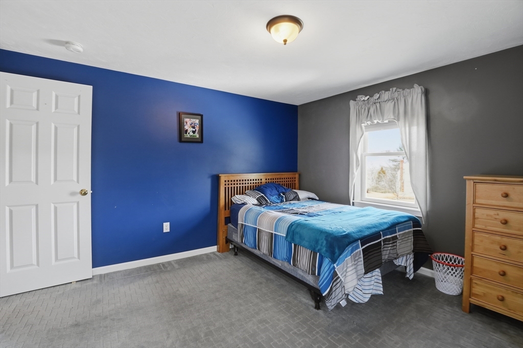 23 Bridle Path Auburn, MA 01501 - Photo 27 of 40 a bedroom with a bed and a window