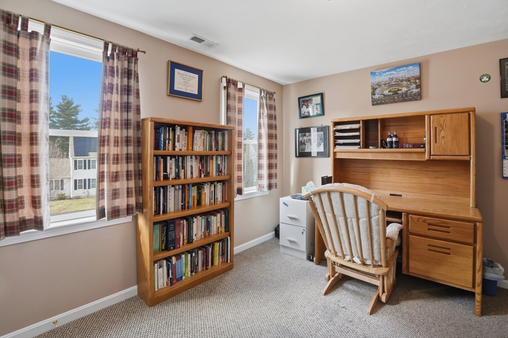 23 Bridle Path Auburn, MA 01501 - Photo 29 of 40 a view of a livingroom with furniture and windows
