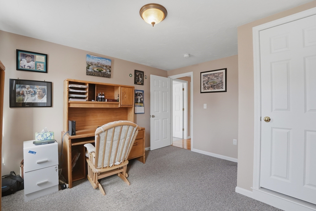 23 Bridle Path Auburn, MA 01501 - Photo 30 of 40 a living room with furniture and a chair