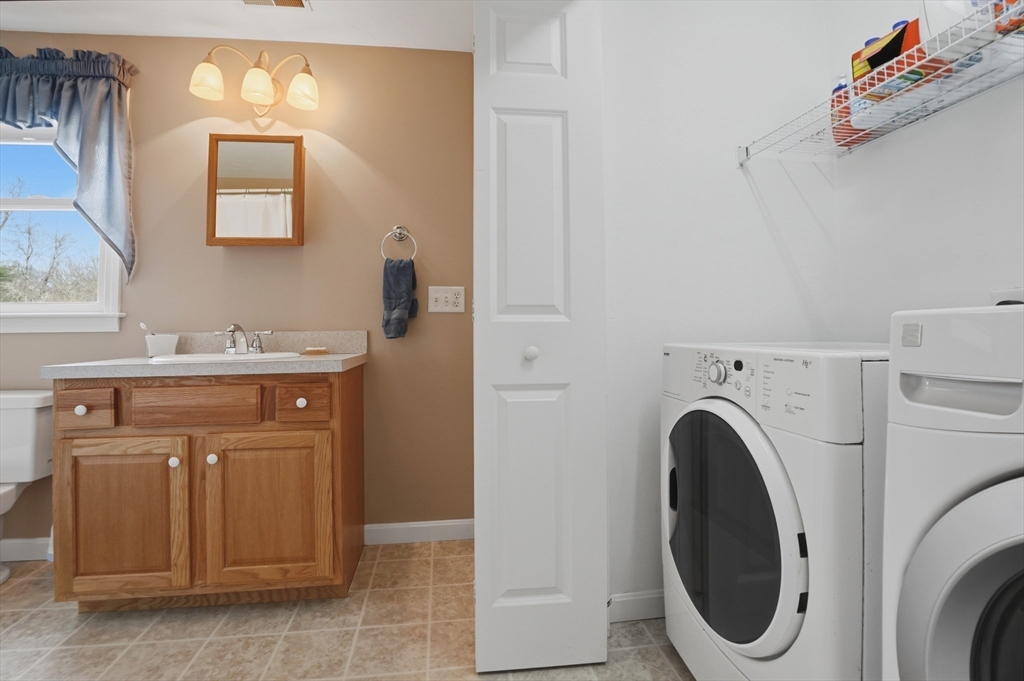 23 Bridle Path Auburn, MA 01501 - Photo 31 of 40 a utility room with dryer and washer