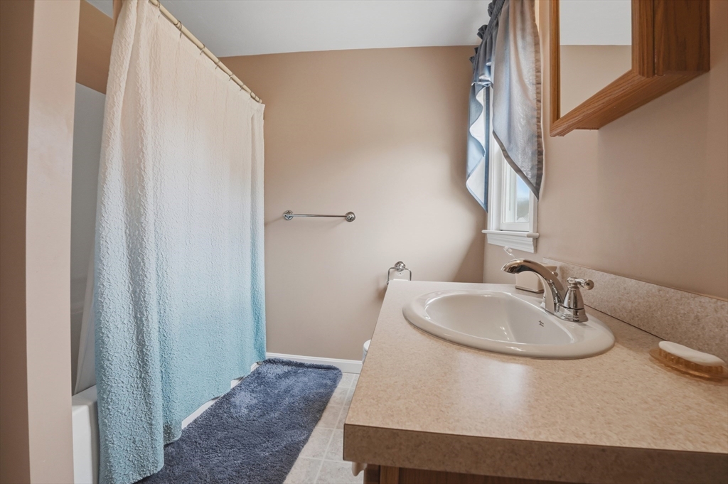 23 Bridle Path Auburn, MA 01501 - Photo 32 of 40 a bathroom with a sink and a mirror