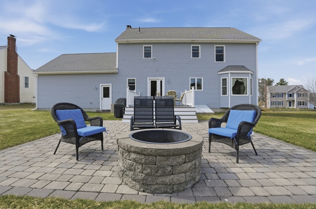 23 Bridle Path Auburn, MA 01501 - Photo 34 of 40 a view of a patio with chair and tables
