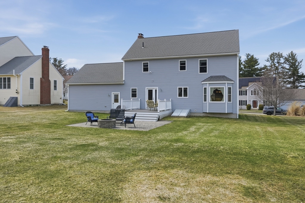 23 Bridle Path Auburn, MA 01501 - Photo 36 of 40 a view of a house with a big yard potted plants and large tree