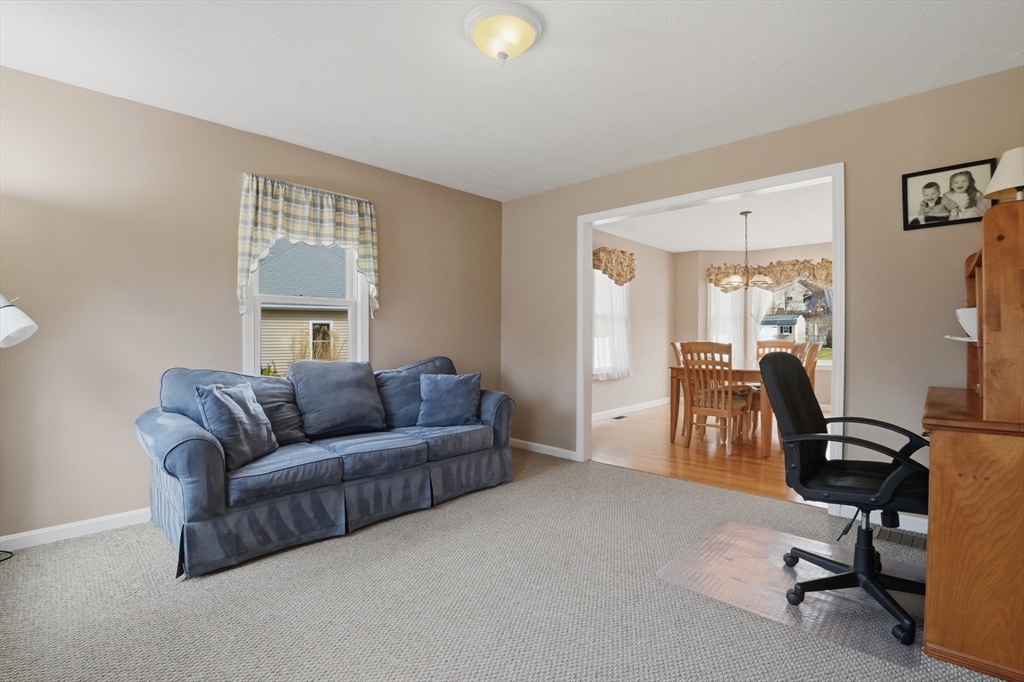 23 Bridle Path Auburn, MA 01501 - Photo 6 of 40 a living room with furniture and a window