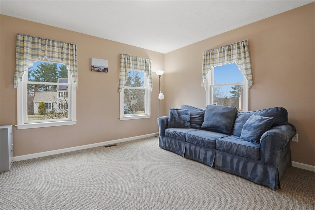 23 Bridle Path Auburn, MA 01501 - Photo 8 of 40 a living room with furniture and a window