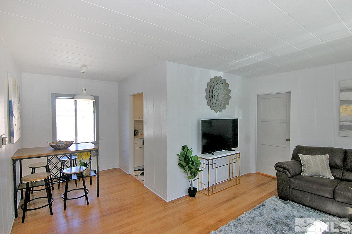 1425 Plumas Street Reno, NV 89509 - Photo 8 of 25 a living room with furniture and a flat screen tv