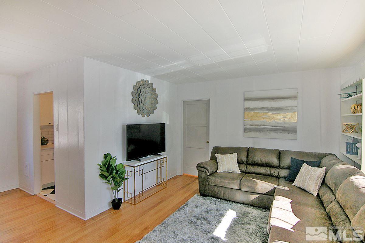 1425 Plumas Street Reno, NV 89509 - Photo 9 of 25 a living room with furniture and a flat screen tv
