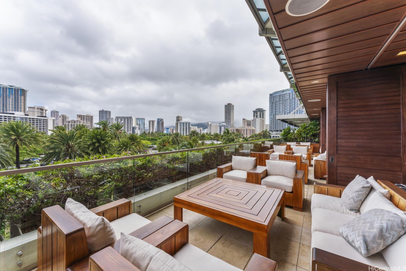 223 Saratoga Road, Unit 1102 Honolulu, HI 96815 - Photo 14 of 23 a view of a terrace with couches and pool