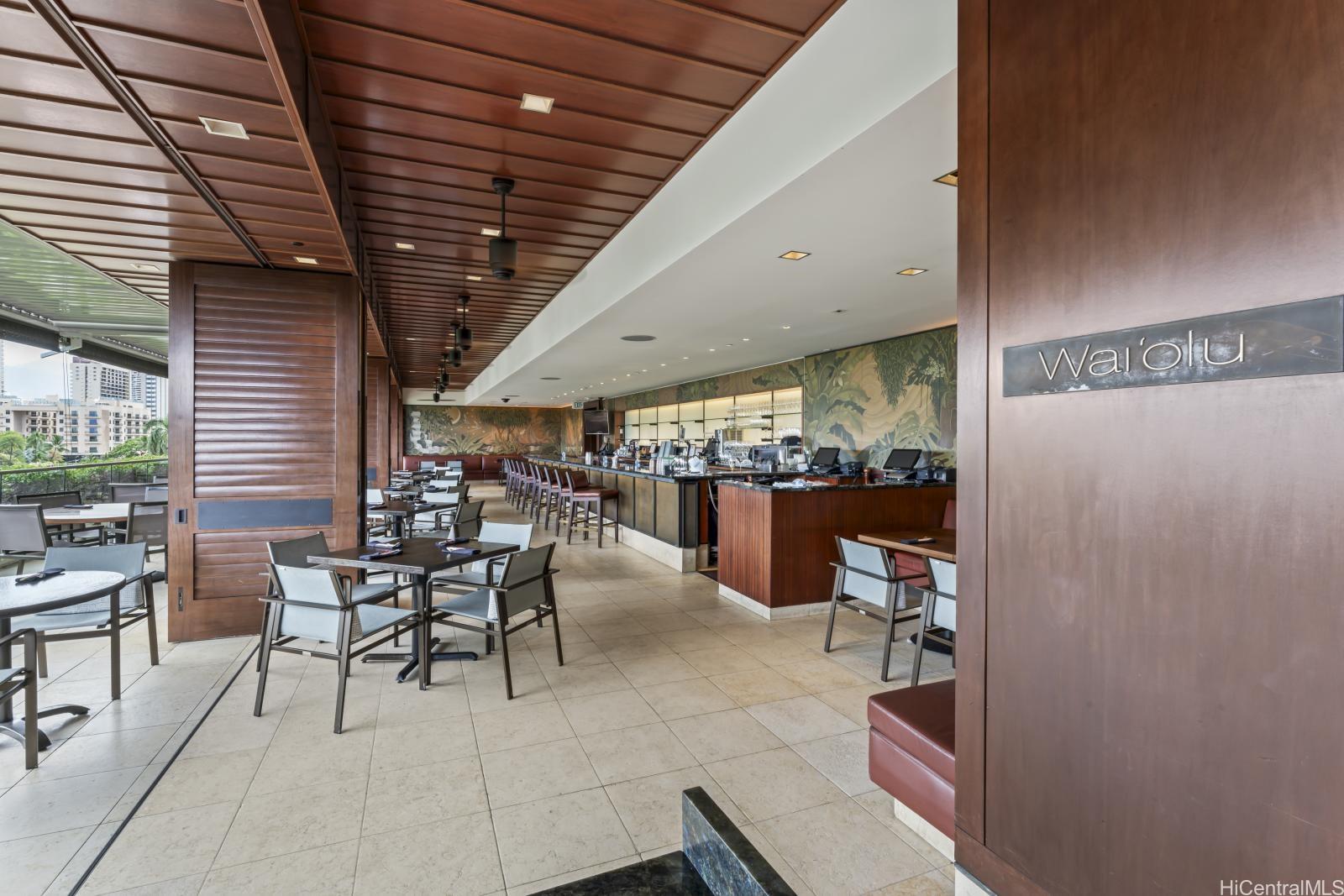 223 Saratoga Road, Unit 1102 Honolulu, HI 96815 - Photo 16 of 23 a outdoor space with lots of tables a garden view and chairs