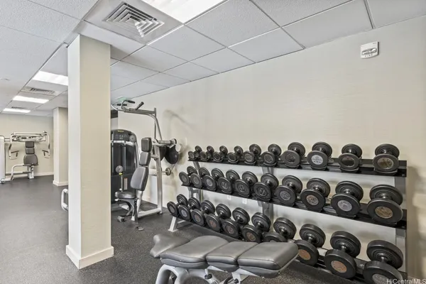 a view of a livingroom with furniture and floor to ceiling window