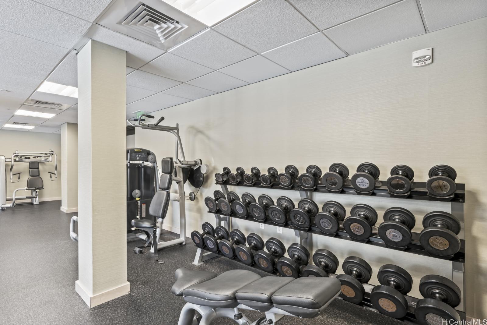 223 Saratoga Road, Unit 1102 Honolulu, HI 96815 - Photo 22 of 23 a view of a livingroom with furniture and floor to ceiling window