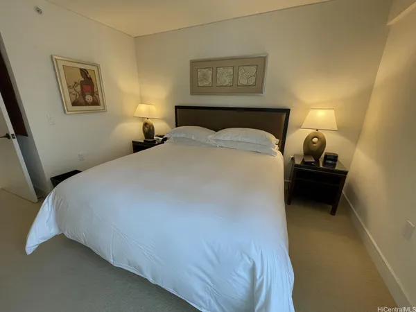 a bedroom with a bed and a walk in closet