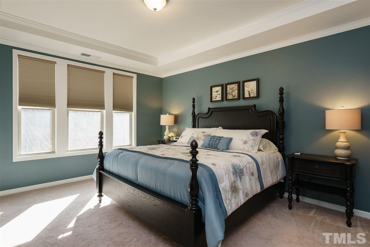 1533 Fullerton Place Raleigh, NC 27607 - Photo 12 of 25 SPACIOUS MASTER BEDROOM ON FIRST FLOOR OF HOME---BEAUTIFUL NATURAL LIGHTING OVERLOOKING THE WOODS, TRAY CEILING, CONNECTING MASTER BATHROOM AND WIC.