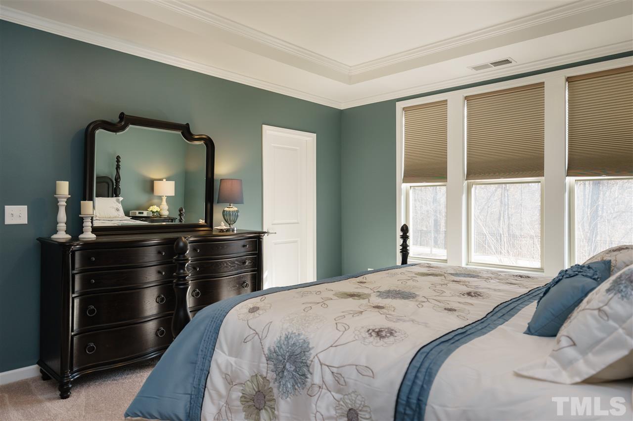 1533 Fullerton Place Raleigh, NC 27607 - Photo 13 of 25 SPACIOUS MASTER BEDROOM ON FIRST FLOOR OF HOME---BEAUTIFUL NATURAL LIGHTING, TRAY CEILING, CONNECTING MASTER BATHROOM AND WIC.