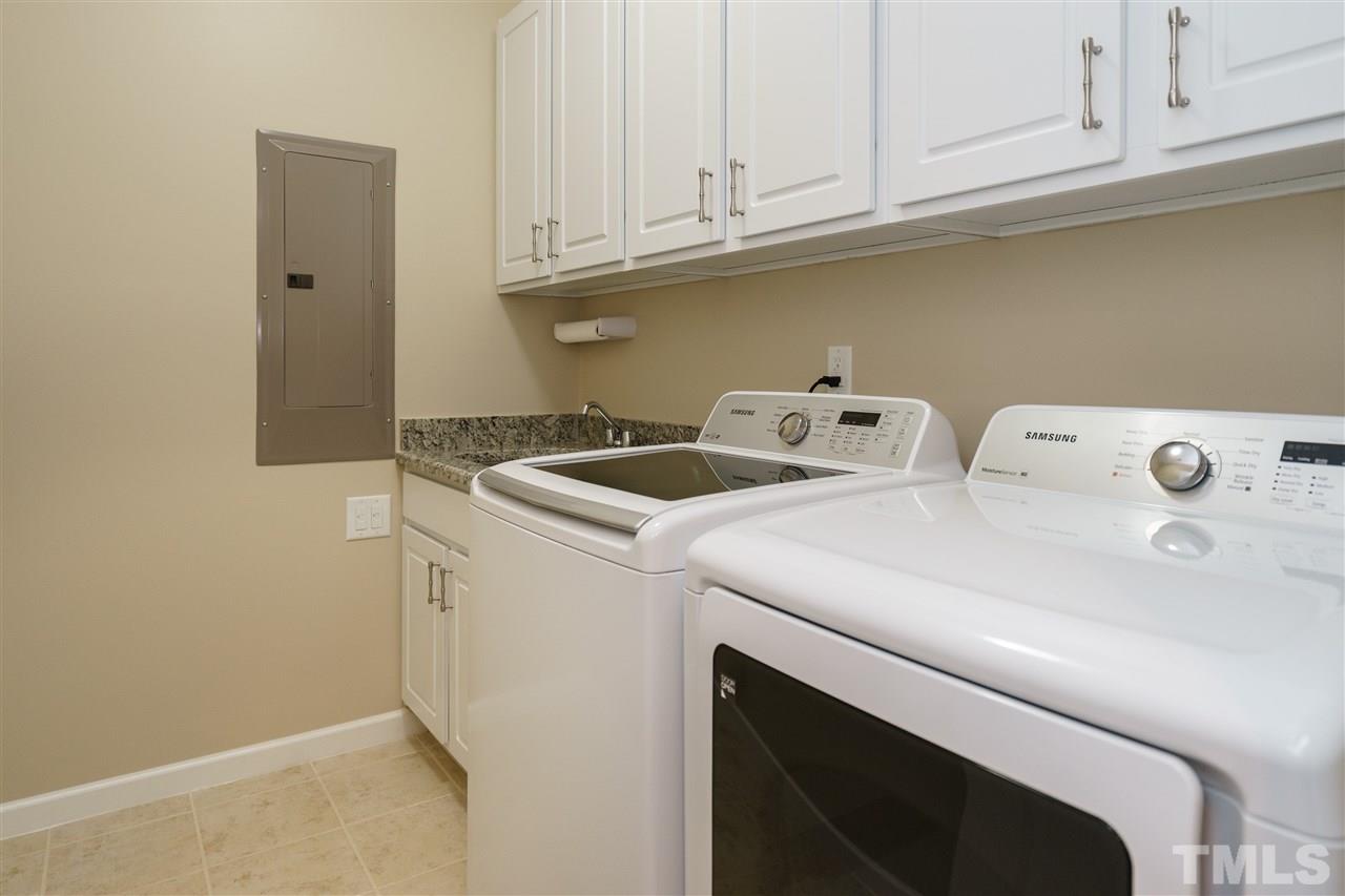 1533 Fullerton Place Raleigh, NC 27607 - Photo 16 of 25 LAUNDRY ROOM INCLUDING SINK AND OVERHEAD STORAGE.