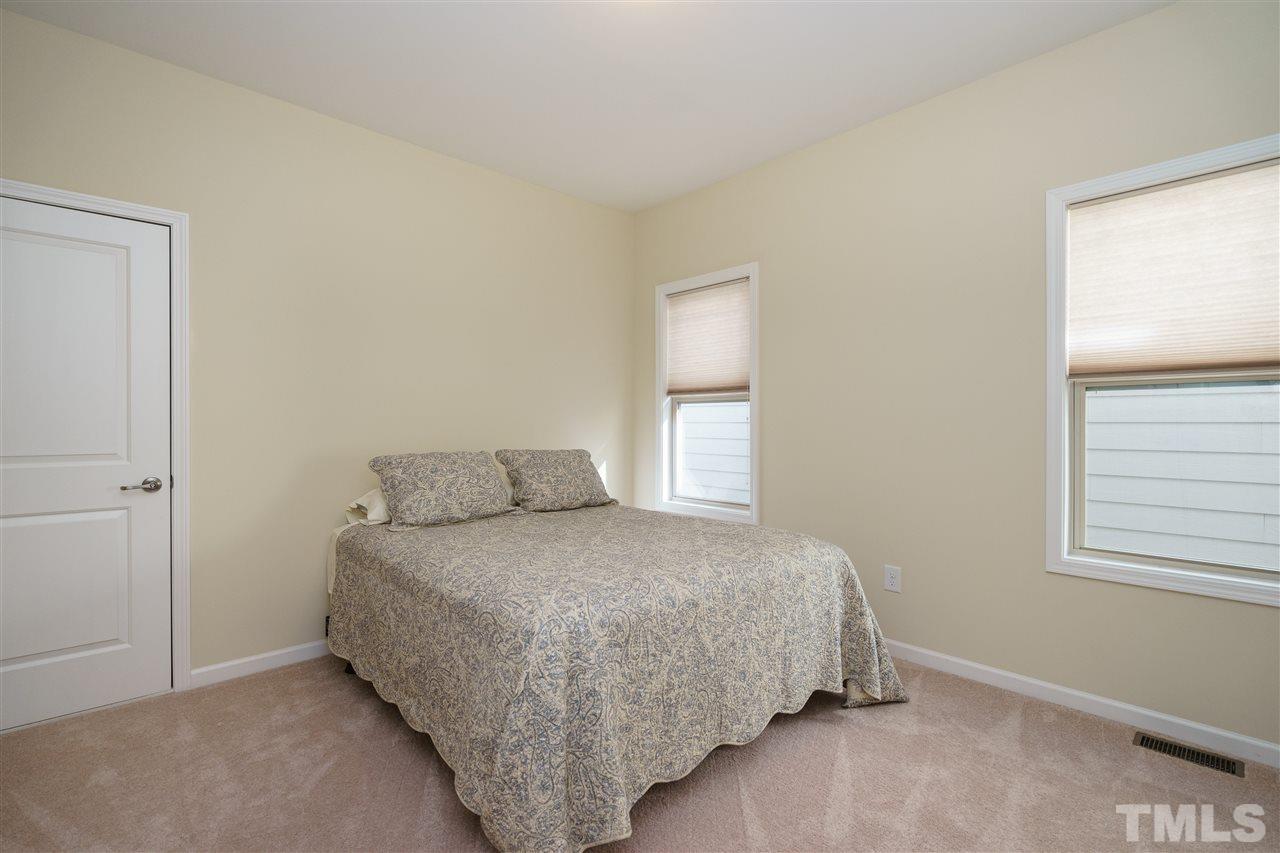 1533 Fullerton Place Raleigh, NC 27607 - Photo 19 of 25 BEDROOM ON SECOND LEVEL OF HOME---CLOSET WITH WOODEN SHELVING!