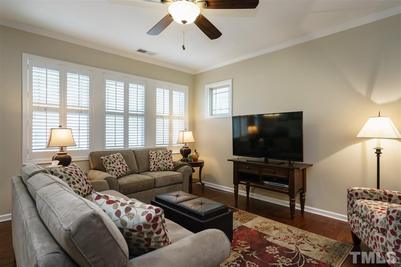 1533 Fullerton Place Raleigh, NC 27607 - Photo 3 of 25 LIVING ROOM WITH BEAUTIFUL HARDWOODS AND NATURAL LIGHTING IS OPEN TO THE KITCHEN AND EATING AREA!