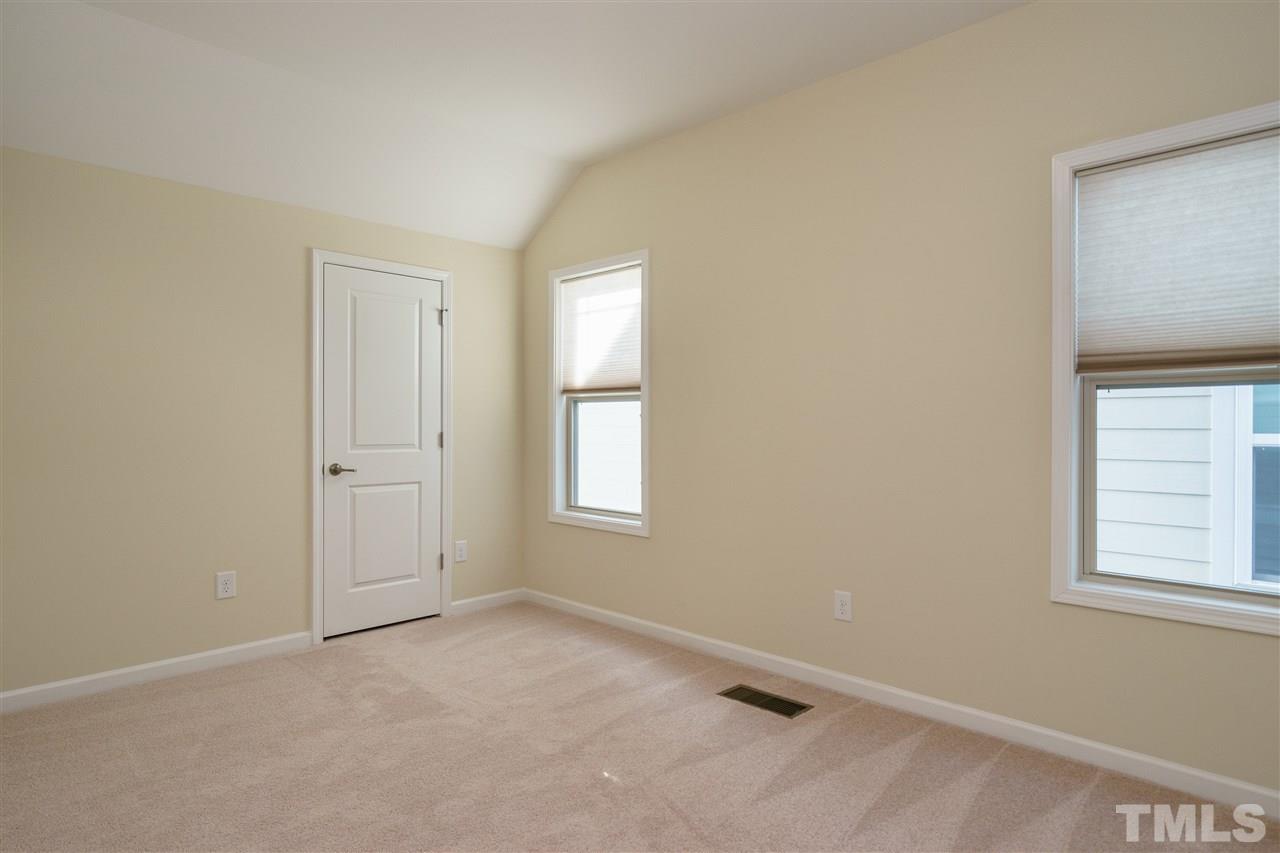 1533 Fullerton Place Raleigh, NC 27607 - Photo 21 of 25 BEDROOM ON SECOND LEVEL OF HOME---ALSO INCLUDES A CLOSET WITH WOODEN SHELVING!