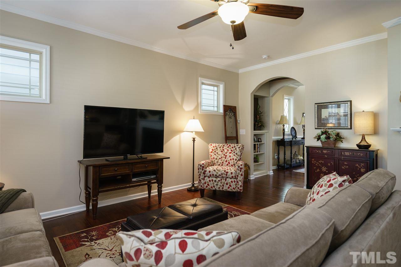 1533 Fullerton Place Raleigh, NC 27607 - Photo 4 of 25 LIVING ROOM HAS LOTS OF WINDOWS WITH NATURAL LIGHT, CEILING FAN, AND GAS FIREPLACE!