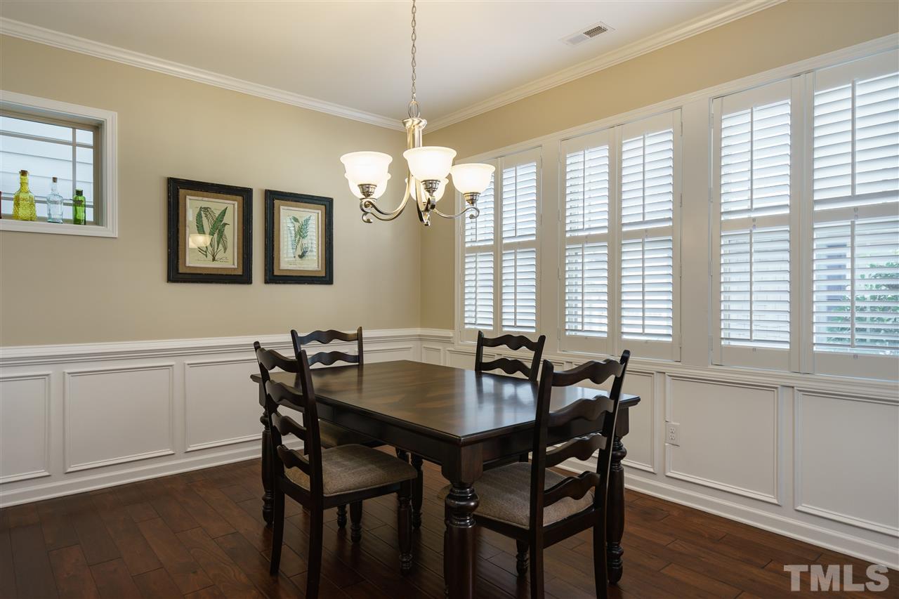 1533 Fullerton Place Raleigh, NC 27607 - Photo 7 of 25 SPACIOUS DINING ROOM---OPENS TO KITCHEN AND LIVING ROOM. UPDATED TRIM DETAIL TO ADD ELEGANCE TO THE SPACE.