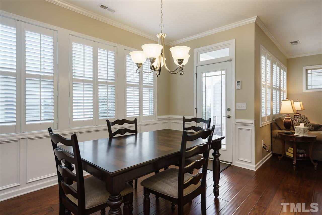 1533 Fullerton Place Raleigh, NC 27607 - Photo 8 of 25 DINING ROOM EASILY OPENS TO BACKYARD SPACE. ENJOYING COOKING OUTSIDE OR INSIDE!