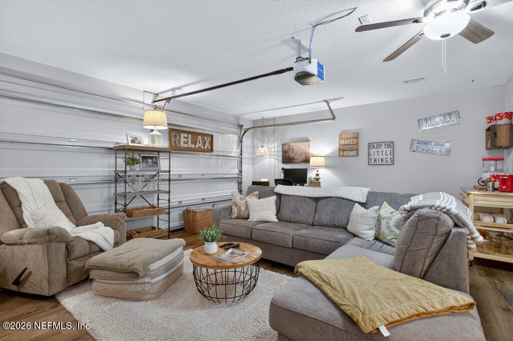 9652 Bridgeway Avenue Jacksonville, FL 32222 - Photo 26 of 35 a living room with furniture and a ceiling fan
