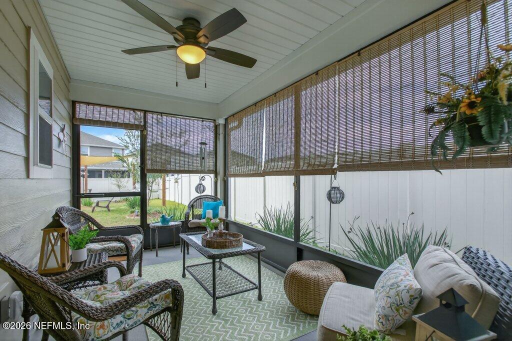 9652 Bridgeway Avenue Jacksonville, FL 32222 - Photo 27 of 35 a living room with furniture and a potted plant