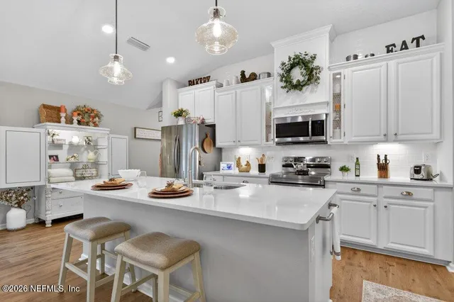 a building outdoor space with patio furniture and potted plants