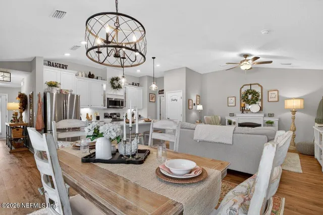 a view of a house with backyard porch and sitting area