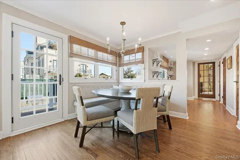 a living room with table and stairs