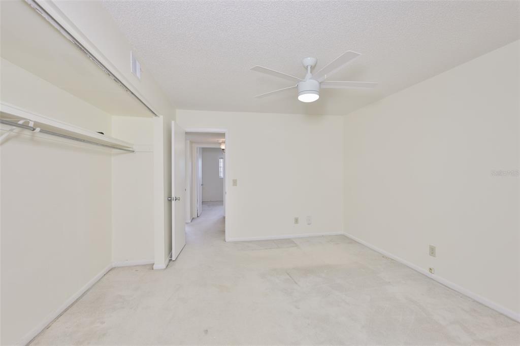 2358 Ecuadorian Way, Unit 56 Clearwater, FL 33763 - Photo 13 of 33 wooden floor in an empty room