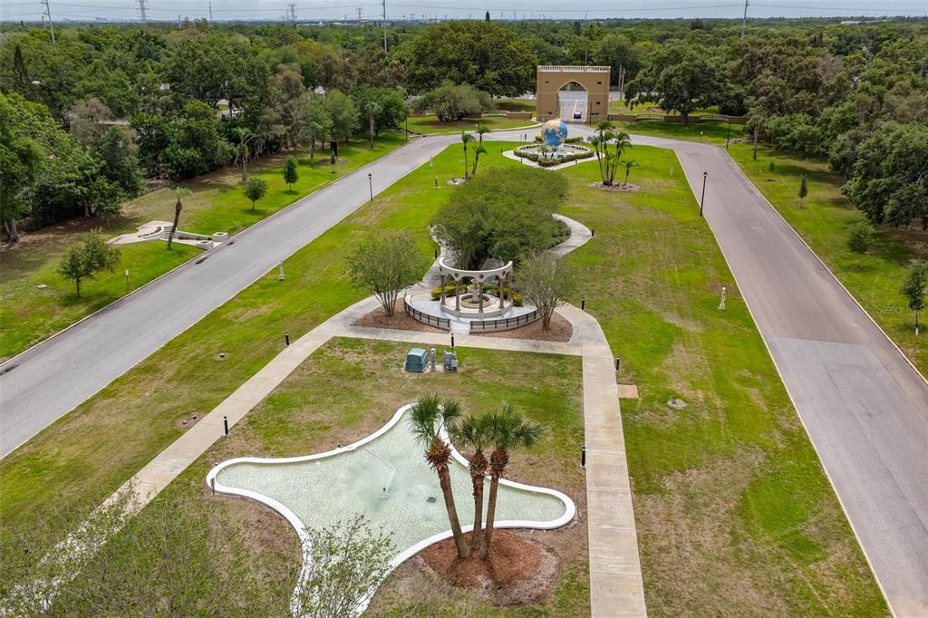 2358 Ecuadorian Way, Unit 56 Clearwater, FL 33763 - Photo 27 of 33 a view of a swimming pool with a garden and seating area