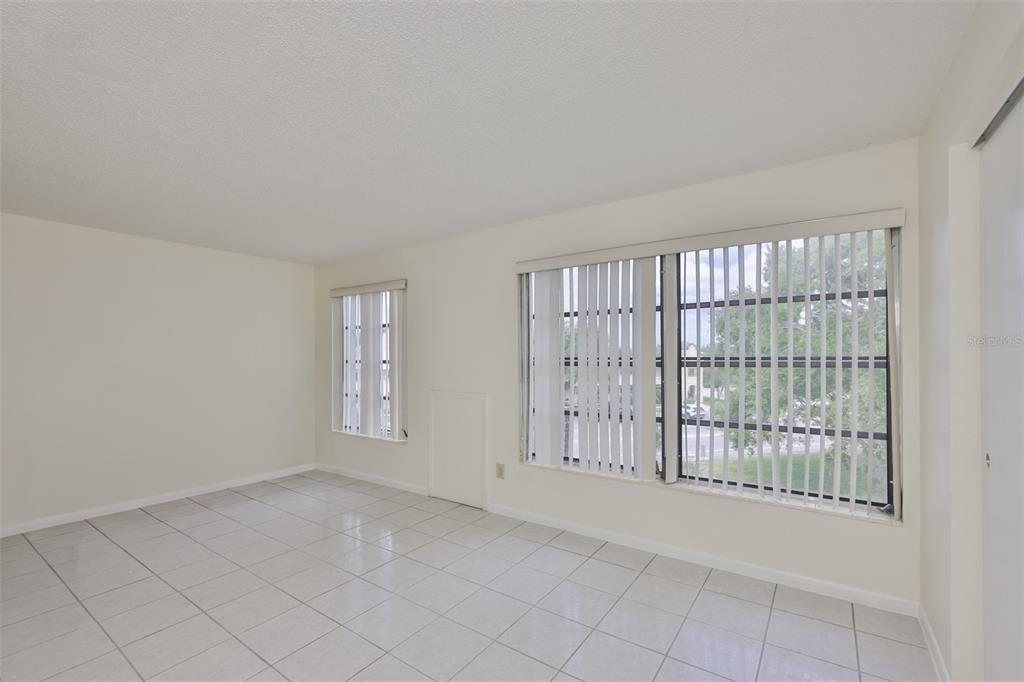 2358 Ecuadorian Way, Unit 56 Clearwater, FL 33763 - Photo 4 of 33 a view of an empty room with a window