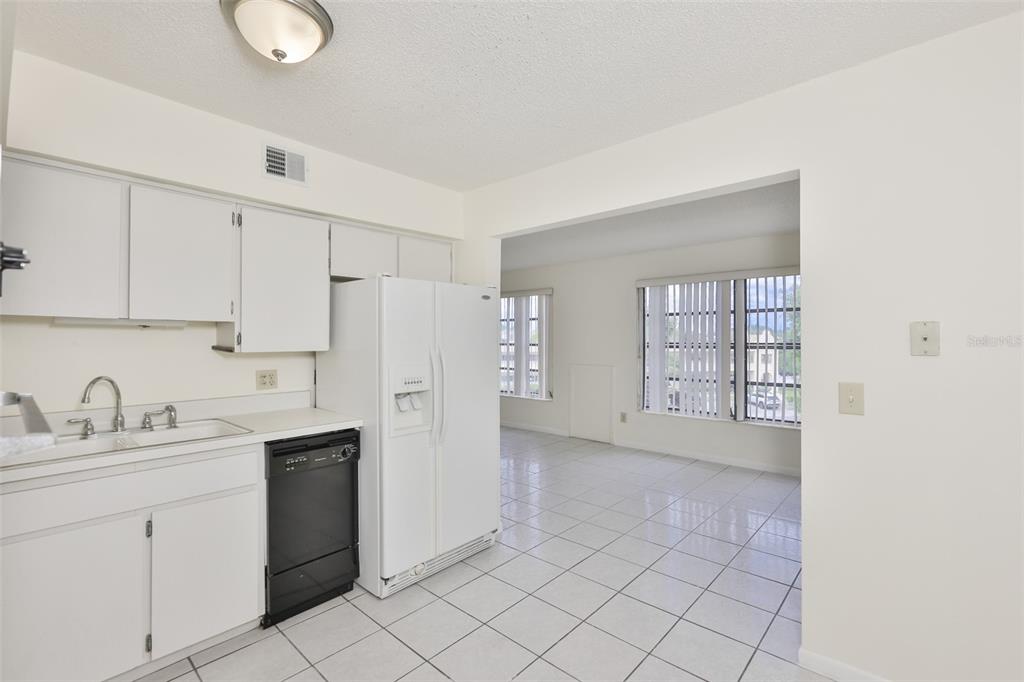 2358 Ecuadorian Way, Unit 56 Clearwater, FL 33763 - Photo 7 of 33 a kitchen with a sink cabinets and appliances