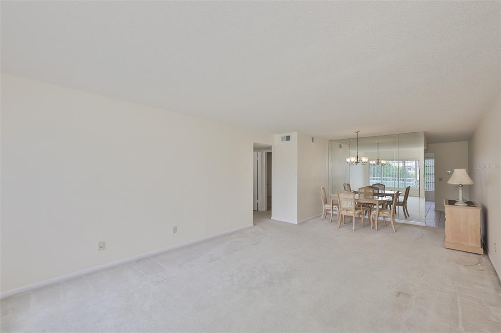 2358 Ecuadorian Way, Unit 56 Clearwater, FL 33763 - Photo 10 of 33 a view of a livingroom with furniture and a window