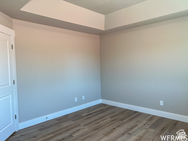 702 North 100 West Logan, UT 84321 - Photo 40 of 58 Empty room featuring baseboards and wood finished floors