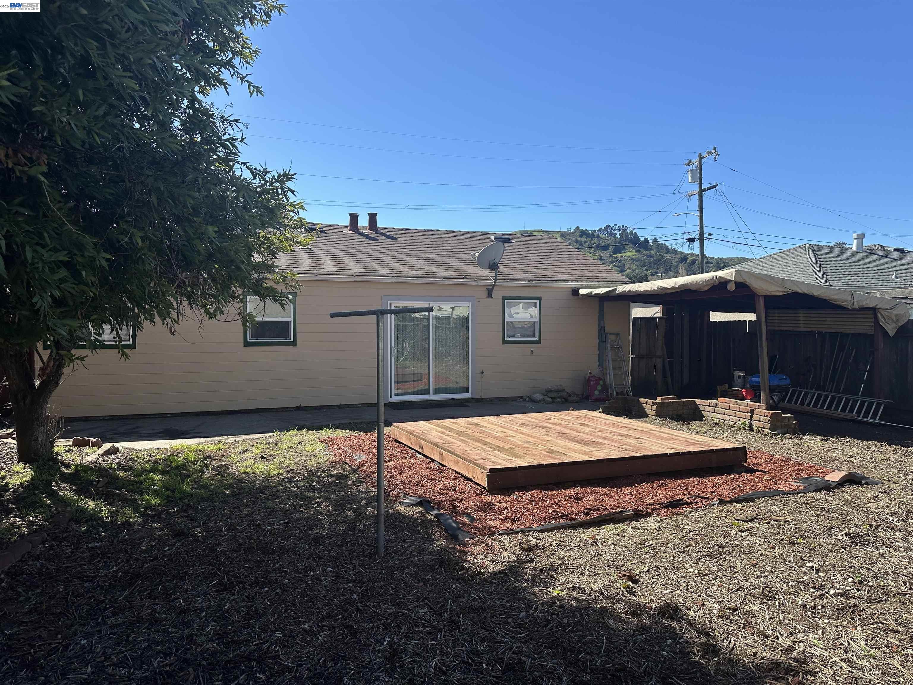 4363 Wesley Way El Sobrante, CA 94803 - Photo 11 of 11 a backyard of a house with barbeque oven table and chairs