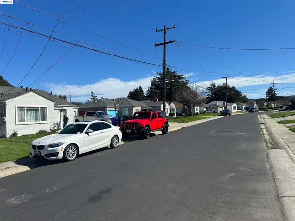 a view of a cars parked in front of a house