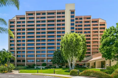 a view of a living room and kitchen
