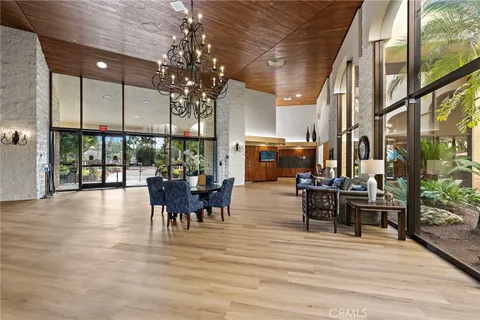 a group of people sitting at tables in a patio