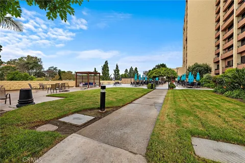 a view of swimming pool with a wooden fence and a lake view