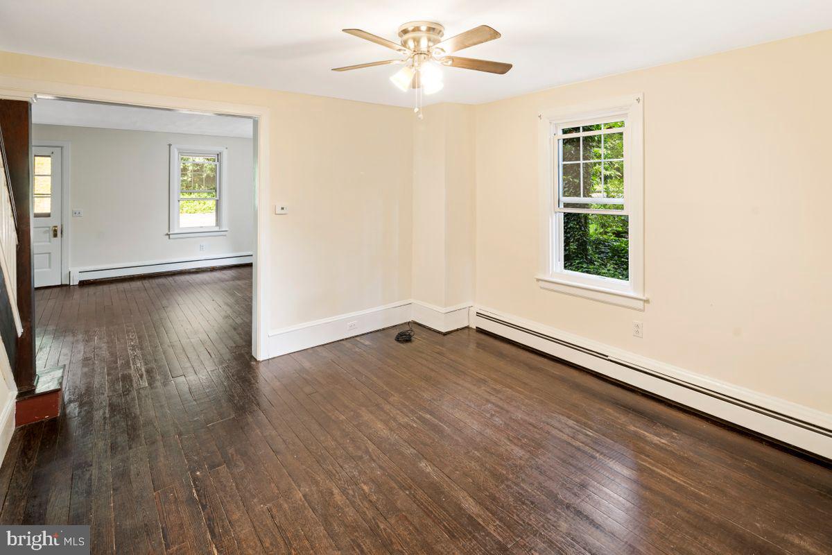 908 Easton Road Riegelsville, PA 18077 - Photo 12 of 43 an empty room with wooden floor and windows