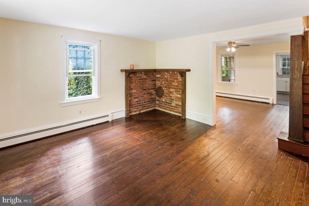 908 Easton Road Riegelsville, PA 18077 - Photo 14 of 43 wooden floor in an empty room with a window