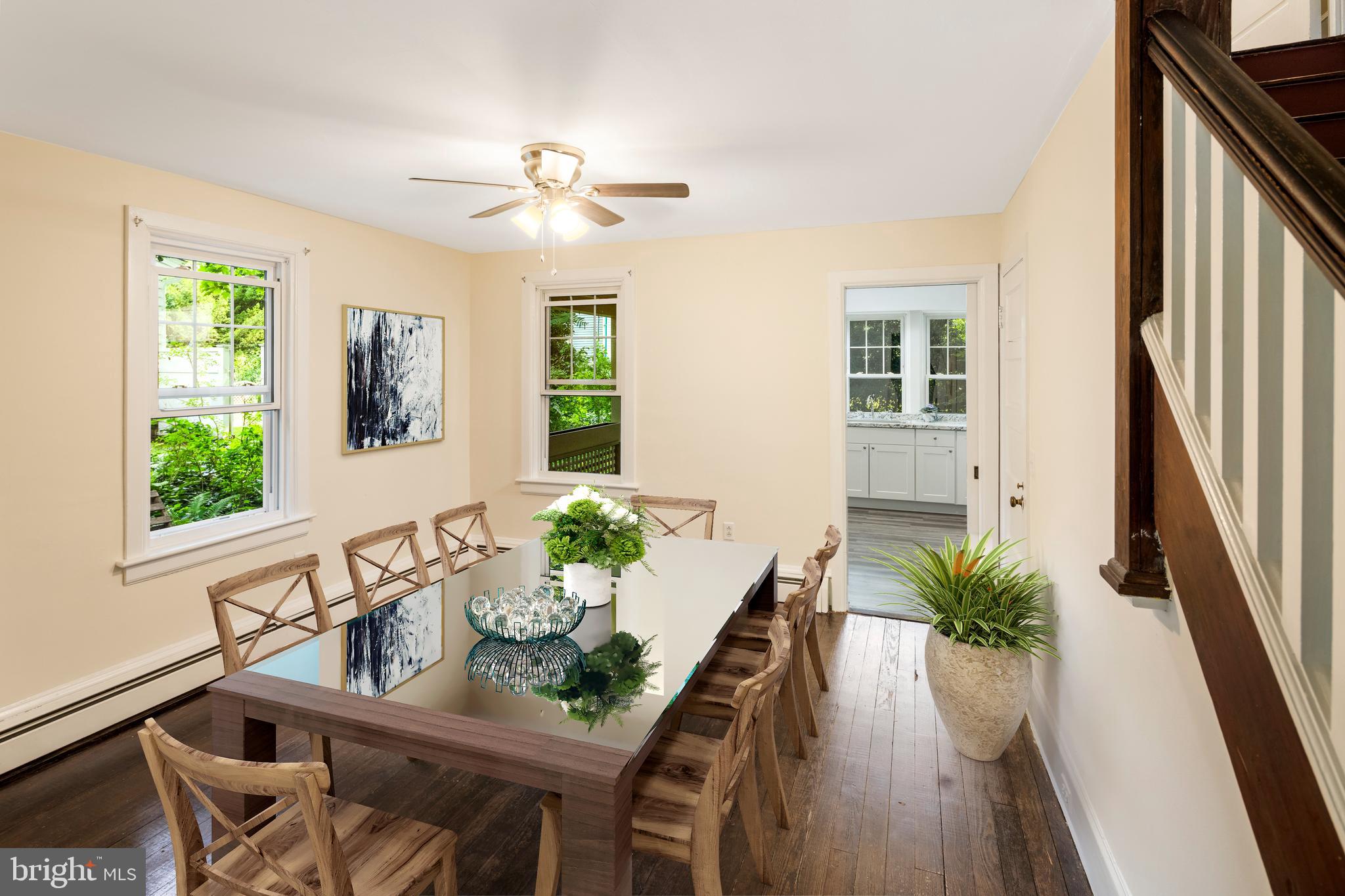 908 Easton Road Riegelsville, PA 18077 - Photo 16 of 43 a dining room with furniture potted plants and wooden floor