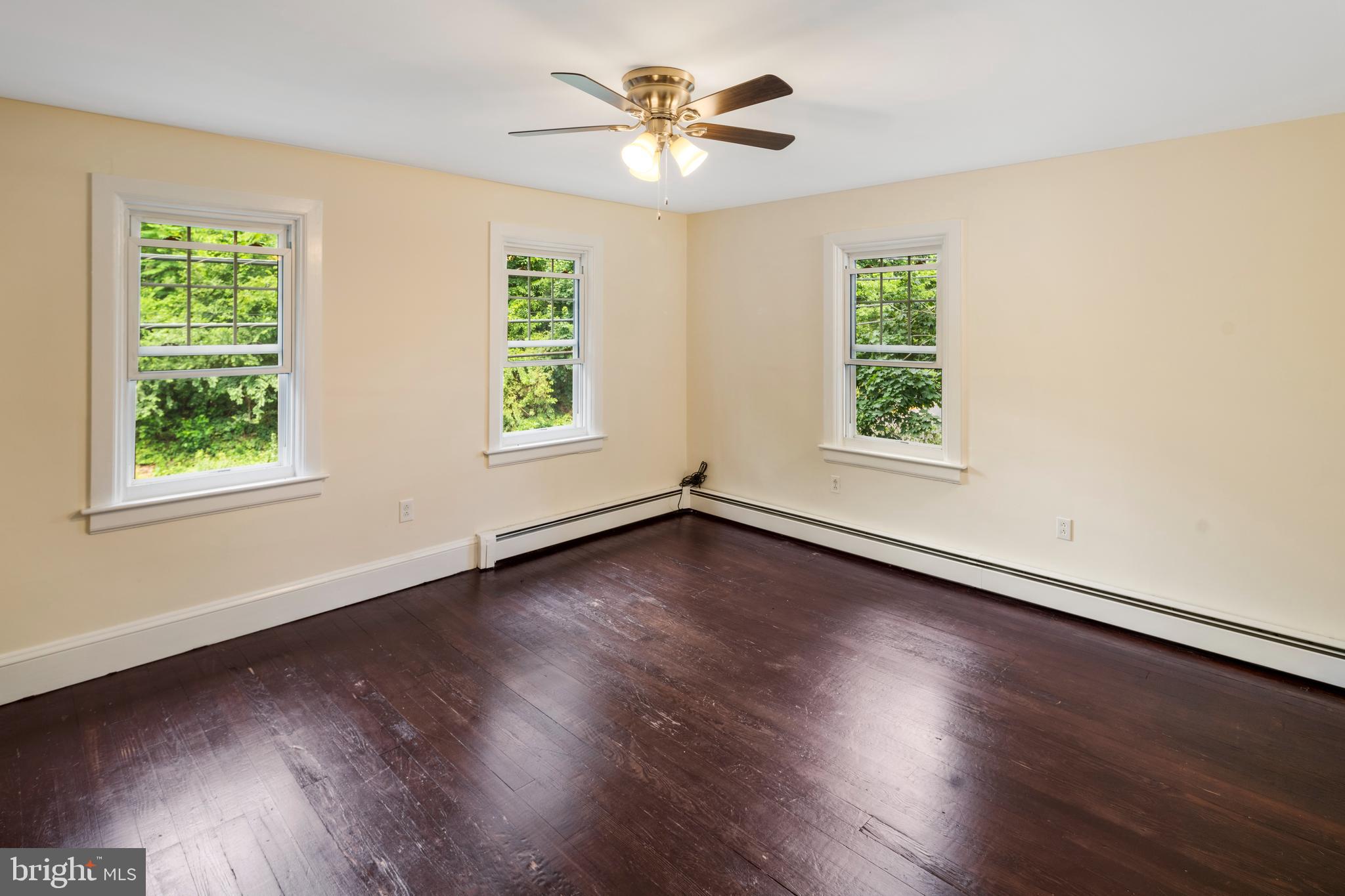 908 Easton Road Riegelsville, PA 18077 - Photo 23 of 43 an empty room with wooden floor and windows