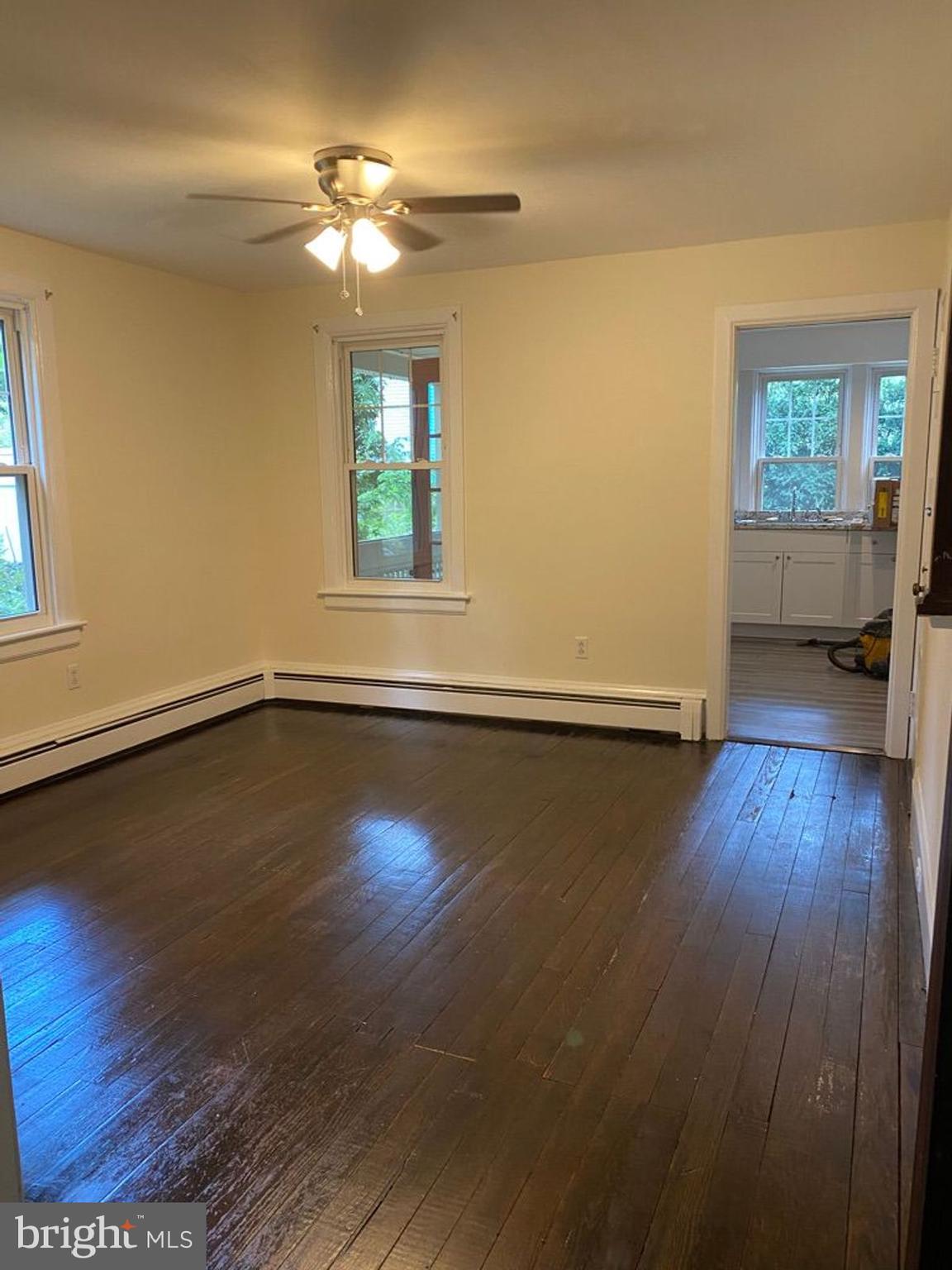 908 Easton Road Riegelsville, PA 18077 - Photo 9 of 43 a view of a livingroom with wooden floor and a window