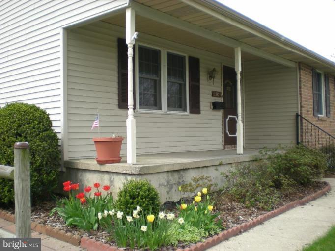 6307 Chesworth Road Catonsville, MD 21228 - Photo 17 of 18 Lovely blooming flowers accent the front