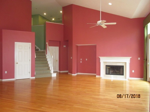 153 Nobscot Road, Unit 153 Sudbury, MA 01776 - Photo 3 of 18 a view of an empty room with a chandelier fan