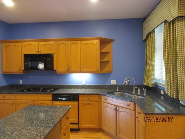 153 Nobscot Road, Unit 153 Sudbury, MA 01776 - Photo 5 of 18 a kitchen with granite countertop cabinets and window