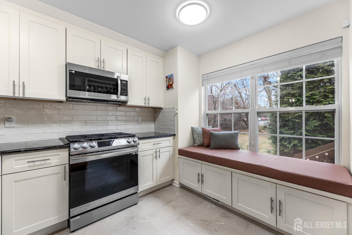 7 Edith Drive Somerset, NJ 08873 - Photo 11 of 49 a kitchen with stainless steel appliances granite countertop a stove sink and microwave